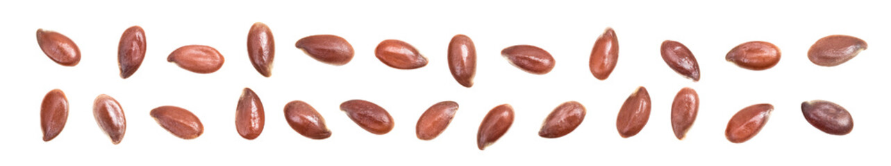 Close up of linseeds or flax seed spread out in ultra wide disorder and isolated on white background