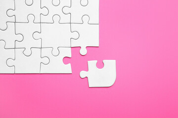 Jigsaw puzzle pieces on color background. Unity concept
