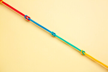 Rubber hair bands on color background. Unity concept