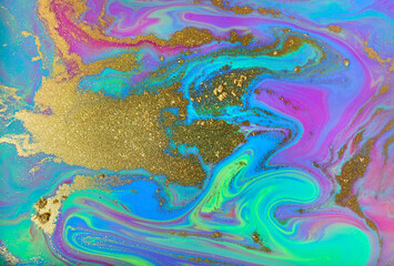 Purple, green and turquoise abstract texture with gold powder copyspace.