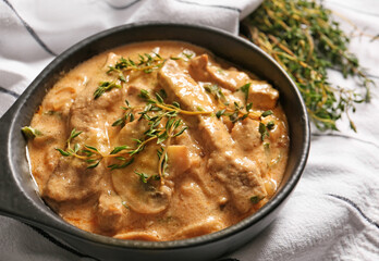 Tasty beef stroganoff on table