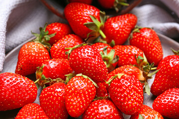 Sweet ripe strawberry on table, closeup