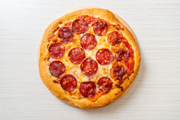 pepperoni pizza on wood tray