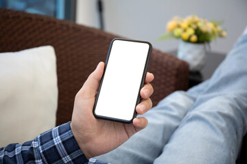 male hand holding phone with isolated screen in the room