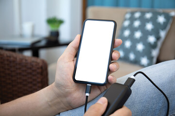 Man hold phone with isolated screen and power bank charge