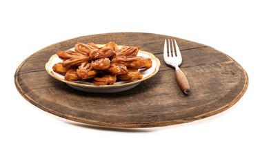 Deep-fried cookies until golden on a wooden board, then coated with honey