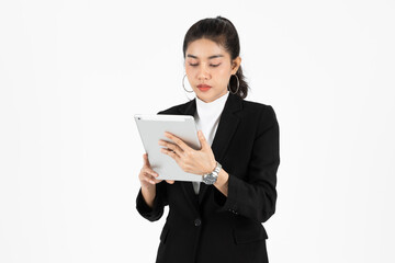 Professional young Asian business woman using tablet for work over white isolated background.