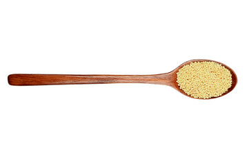 Wooden spoon and millet on an isolated background