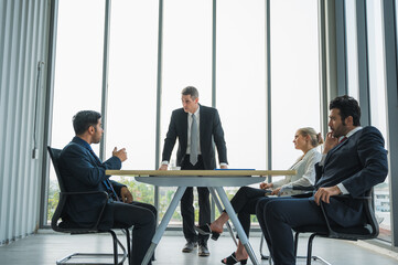 Senior leadership of business during conference discussion with professional teamwork. Business people working in office.