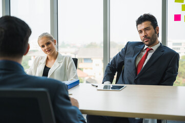 Senior leadership of business during conference discussion with professional teamwork. Business people working in office.