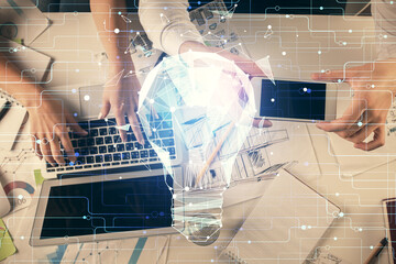 Double exposure of man and woman working together and bulb drawing. Computer background. Top View. Idea concept.