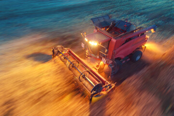 Combine harvester agriculture machine harvesting golden ripe wheat field