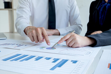 Two business leader discussing the charts and graphs showing the results, Planning to start new strategy for big success In the office