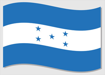 Waving flag of Honduras vector graphic. Waving Honduran flag illustration. Honduras country flag wavin in the wind is a symbol of freedom and independence.
