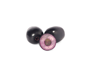 Jambolan plum, Cut in half ripe fruit or fresh Java plum Bushy Dark purple plum, natural light. Syzygium cumini isolated on a white background.