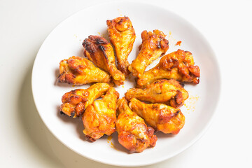 Grill BBQ Chicken Legs with oven air fryer.healthy cooking without oil.arranged on a large white plate.