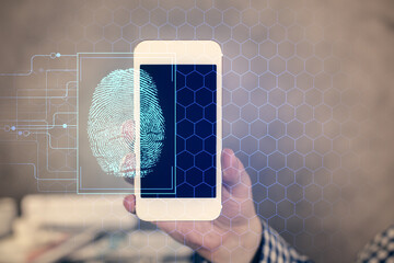 Double exposure of man's hands holding and using a digital device and fingerprint hologram drawing. Security concept.
