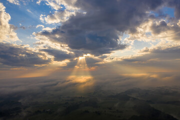 aerial view of Sunrise among forests, meadows and fields