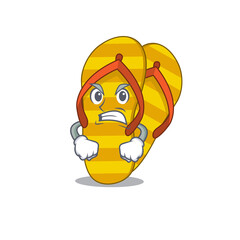 A cartoon picture of flip flops showing an angry face