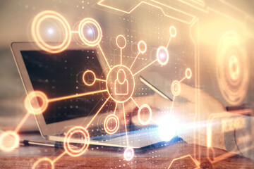 Double exposure of man's hands holding and using a phone and social network theme drawing.