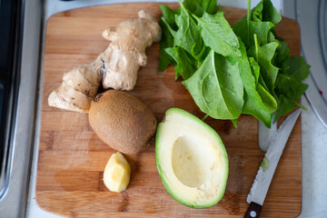 ingredients for smoothies - kiwi, avocado, spinach and ginger. healthy food. 