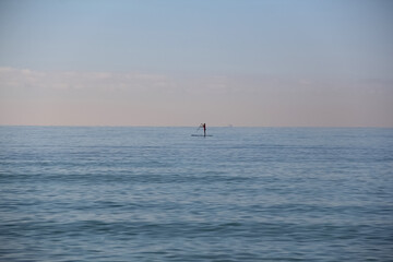 One person is sailing in the sea on a surfboard. Mallorca, Spain. Balearic Islands