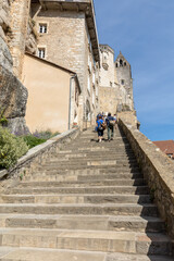  People on steep steps Big stairs at Pilgrimage town of Rocamadour, Episcopal city and sanctuary of the Blessed Virgin Mary, Lot, Midi-Pyrenees, France
