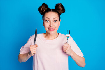 Photo of pretty funny hungry lady two funny buns hold metal fork knife wait to try tasty meal...