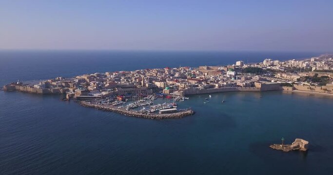 Acre Israel: Aerial footage of the old City and Port of Acre or Akko, Israel. Pull back shot.