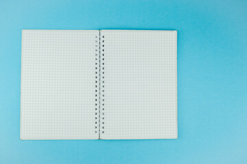 Notebook on the blue background