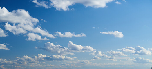 Bright beautiful blue sky with soft clouds, bright sunny day