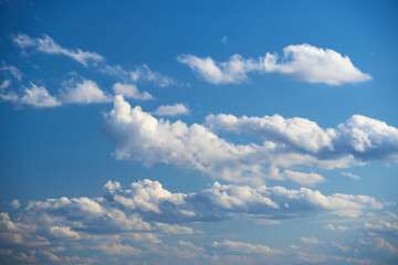 Bright beautiful blue sky with soft clouds, bright sunny day