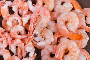Background of cooked tails different shrimps on dish close-up
