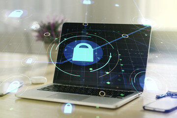 Creative lock sketch with chip hologram on modern laptop background, protection of personal data concept. Multiexposure