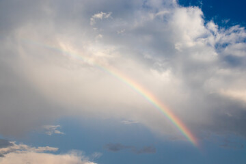 rainbow over blue sky