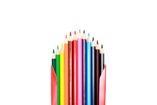 color pencils in a cardboard red box on a white background.