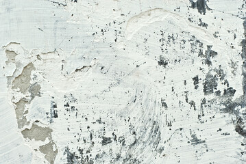 Texture of an old concrete wall with cracks. Black and white wall with dirt and scratches.