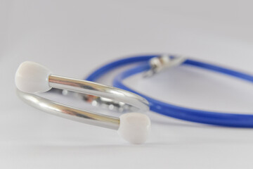 Close-up of blue stethoscope medical on white background. Idea for doctor diagnostic coronavirus disease.