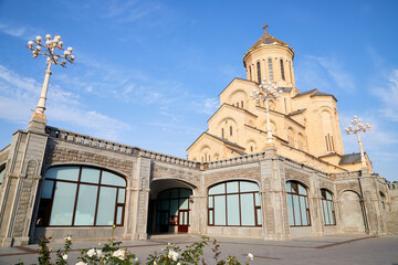 Fototapeta na wymiar Tbilisi, Georgia - October 21, 2019: Big orthodox cathedral St. Trinity or Chirch Sameba in Tbilisi city in Georgia and blue sky background