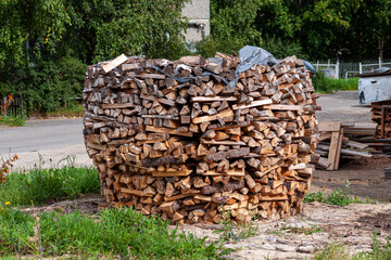 firewood beautifully stacked into a woodpile