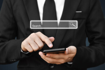 Businessman using smartphone to find information. Concept of search data on internet network.