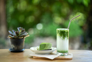 Close up matcha ice green tea on wooden table.