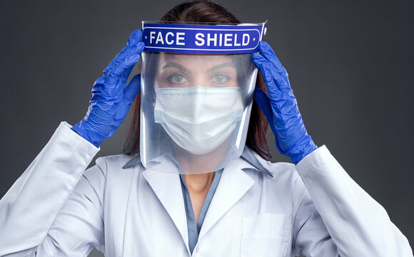 Female Doctor In Protective Face Shield