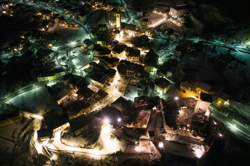 Ossana village in Italy at night aerial drone photo