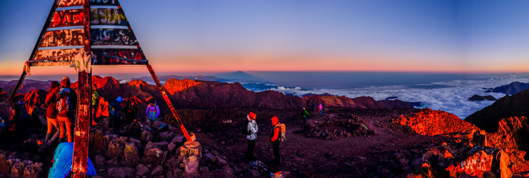 On the summit of Jebel Toubkal, highest mountain in Morocco during sunrise.
