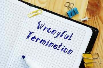 Career concept about Wrongful Termination with phrase on the sheet.