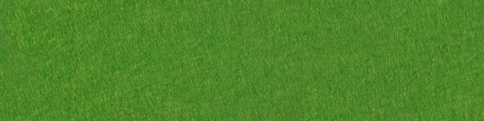 Poker table felt background in green color. Panoramic seamless texture.