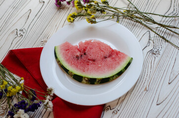watermelon slices on a white plate