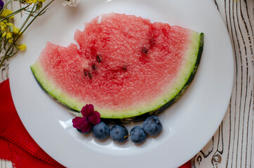 watermelon slices on a white plate