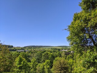 Fototapeta na wymiar Rural scene with blue sky and greenery in rural Germany